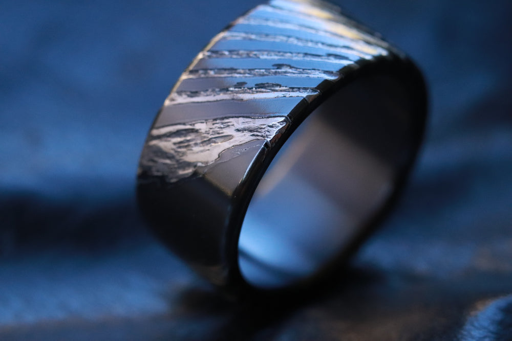 Stone weathered 6mm-10mm wide timascus ring, black titanium lined