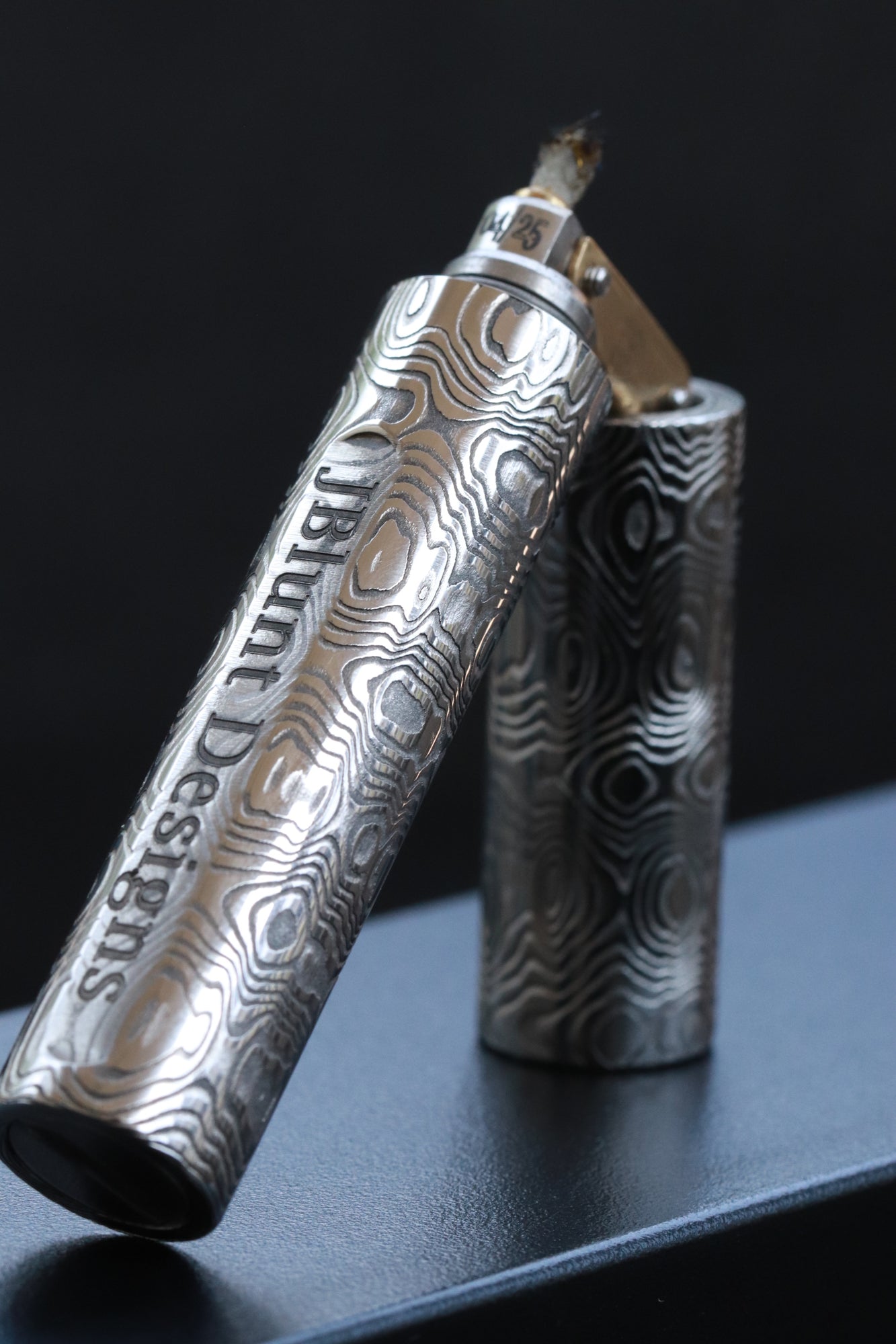 Wind proof trench lighter fluid filled damasteel damascus lighter JBlunt Designs, Inc. Wind proof trench lighter fluid filled damasteel damascus lighter JBlunt Designs, Inc.