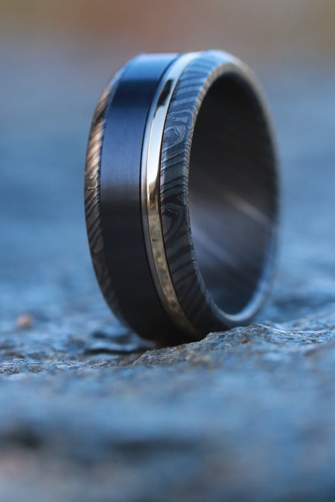 18k gold /  Zirconium niobium damascus / titanium & black titanium ring