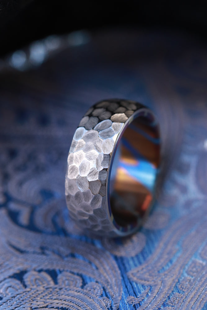 Weathered pattern domed titanium damascus ring
