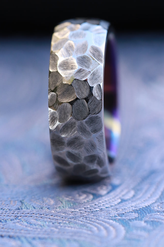 Weathered pattern domed titanium damascus ring