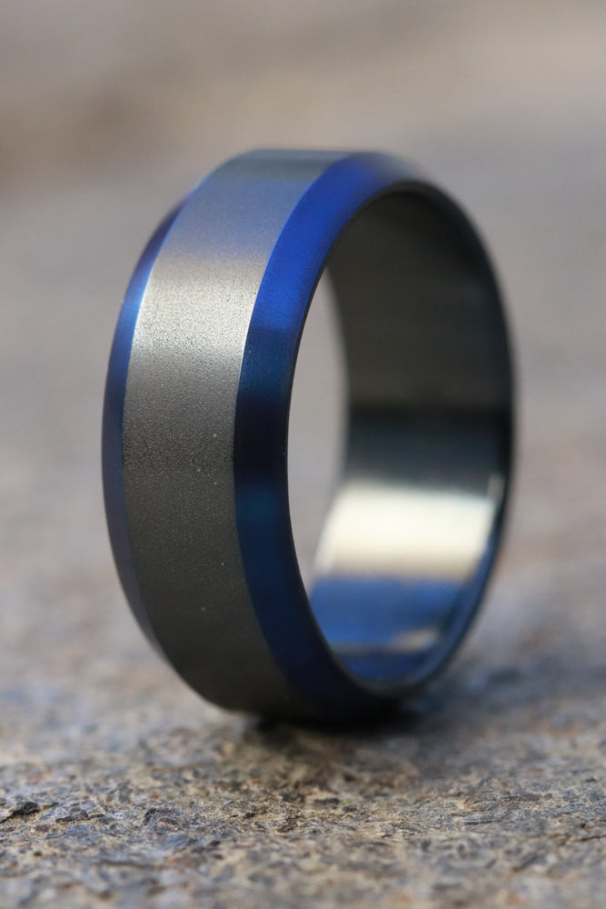 Black titanium ring 8mm wide blue / black chamfered titanium ring