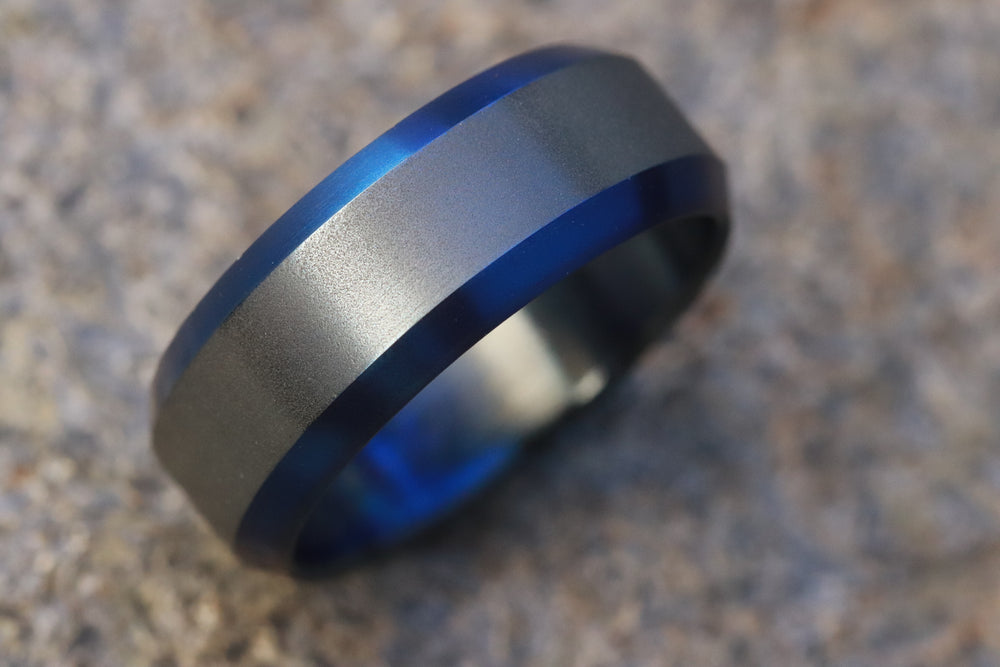 Black titanium ring 8mm wide blue / black chamfered titanium ring