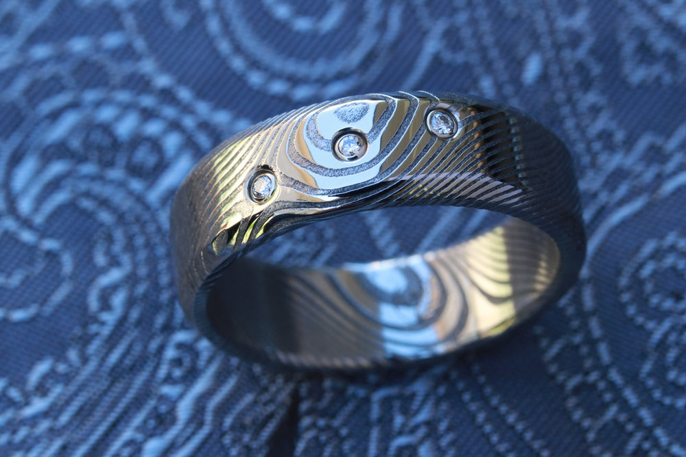 X3 VS1 diamonds 14k wht gold damasteel band