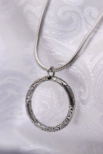 Necklace and ring style pendant damasteel