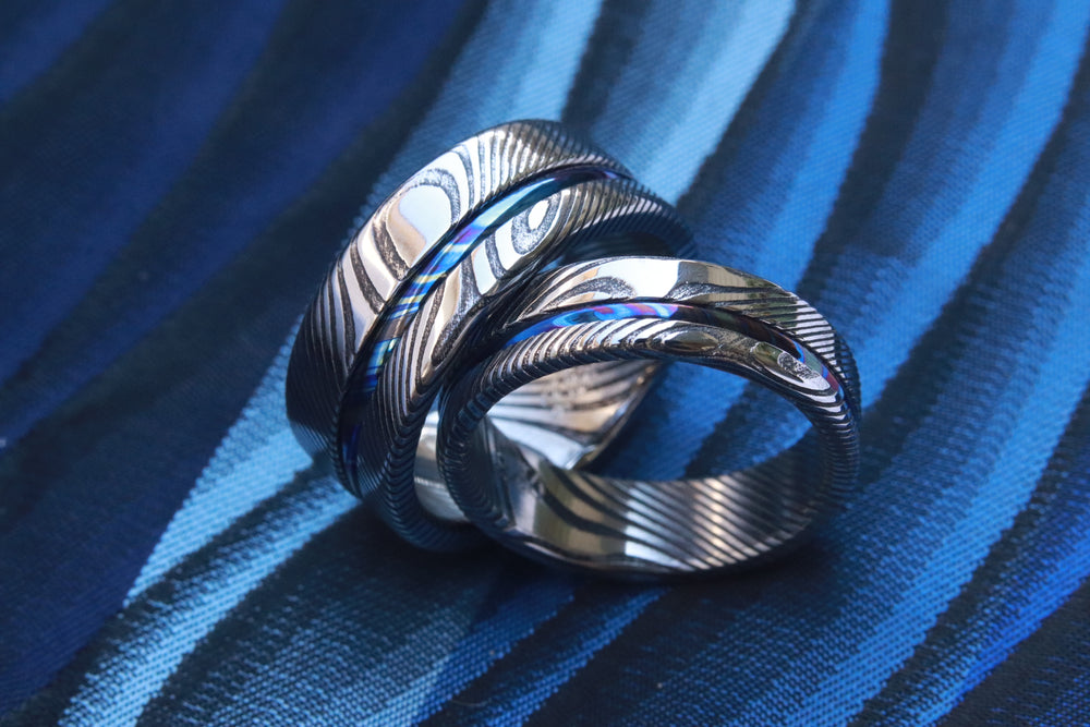 Matching ring set 8mm /5.5mm wave damasteel and ZrTi band